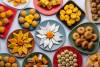 Group of Indian assorted sweets or mithai with diya